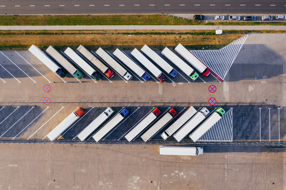 The world of paper cups trucks parked beside highway